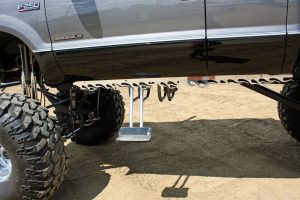 Long-reach motorized swing-down side steps are used to get into the big truck, while the flamed pinch weld covers improve the very visible look of the bottom of the cab.