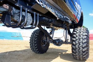 Looking under the truck you can see the custom transmission mount and integrated transfer case protection, along with the complete suspension system.