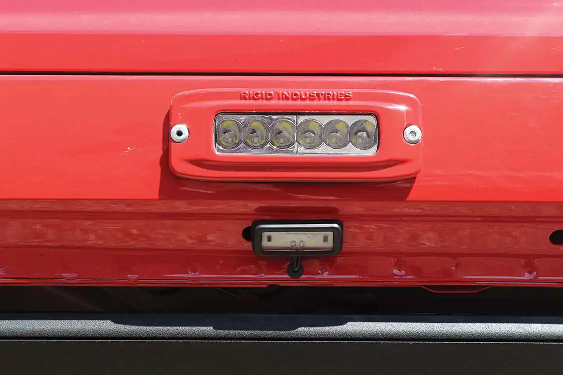 4 Rigid SRQ-2’s (top) are frenched into the rocker panels with AMP’s step lights below. 