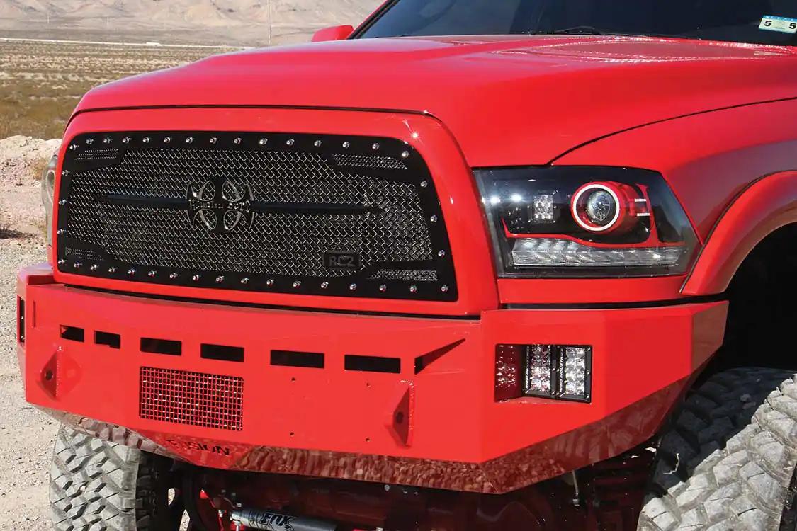 Fusion bumpers, color-matched by 5 Kings, protect the front and rear of the truck. Upfront a Royalty Core RC1 grille replaced the stock plastic unit.