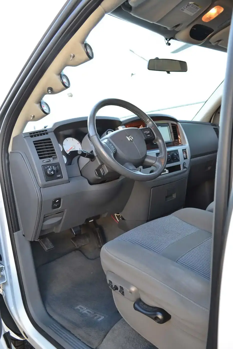 The interior of Aaron's Dodge is mostly stock, save for a full complement of ISSPRO gauges.