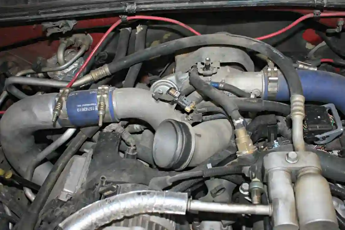 With the air intake system off the truck, you’ll get a good look at the factory cast aluminum turbo inlet horn. While the horn shows a large near 4-inch diameter at the inlet side, it hides its pitfalls well as it necks down to just 2 ¾ inches on the exit where it mates up to the turbocharger inlet. This is the perfect time to swap it out for the high-flow intake horn from Deviant Race Parts.