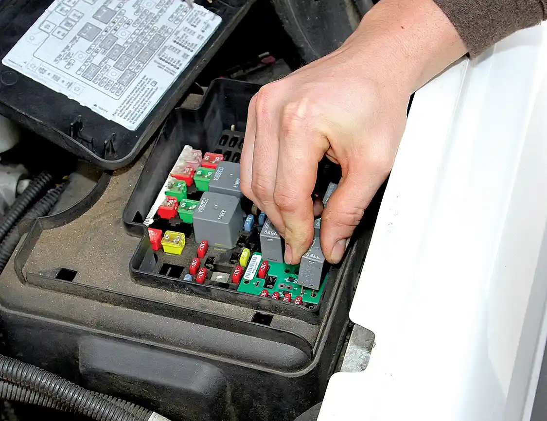 7. Putt then reinstalls the relays through the Fleece module to enable the all-on functionality. The relays can be reinstalled in any location as they are each the same part. Putt then put the cover back on the fuse box, closed the hood and turned on the high beams to sit back and admire all his hard work.