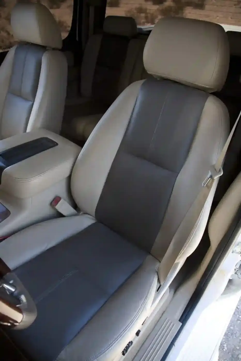 The seats have been recovered, front and rear, with Katzkin leather that matches the factory tan carpet and gray accents.
