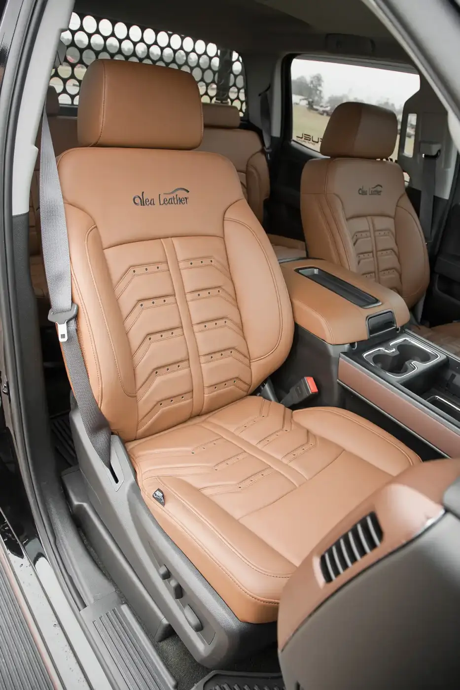 The interior is mostly stock, with the stock seats being recovered with Amaretto-colored Nappa grain leather covers from <a href="http://www.alealeather.com/eng/index.php">Alea Leather</a>. The sound system was also upgraded with <a href="https://www.kicker.com/">Kicker</a> speakers tied into the factory touchscreen head unit.