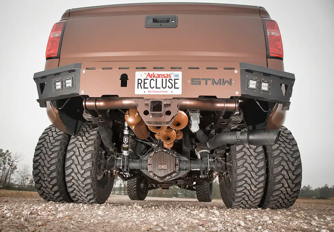 Under the rear of the truck, a set of 5-inch lift leaf springs from Atlas complements the McGaughys front suspension. As with the front, Icon Vehicle Dynamic¬¬ shocks are used. A set of Firestone air bags helps keep the truck level, even with a full load. To feed the air bags and HornBlasters air horns, a Viair compressor system was also installed. The final upgrade under the bumper is the Mag-Hytec differential cover. Regarding the bumper, it’s from ShowTime Metal Works. It works with the rear receiver hitch and sports two pairs of OLB LED lights on each corner.