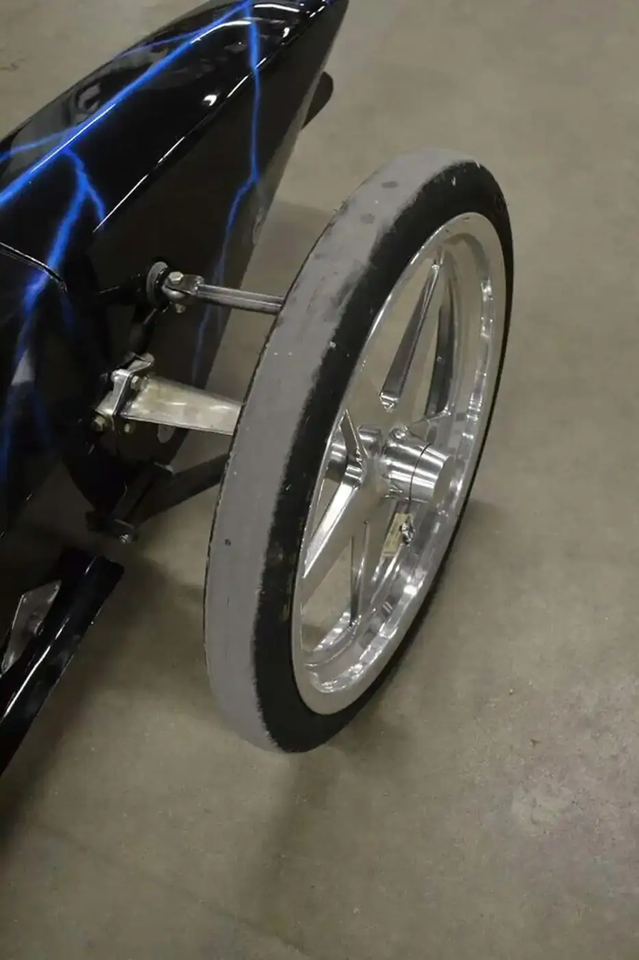<a href="https://www.goodyear.com/">Goodyear</a> Eagle Top Fuel Frontrunner tires are mounted on <a href="https://www.weldwheels.com/">Weld</a> wheels on the front of the dragster and can survive 300mph blasts. On this type of application, the entire chassis flexes enough to provide slight dampening, so no front or rear suspension is used.