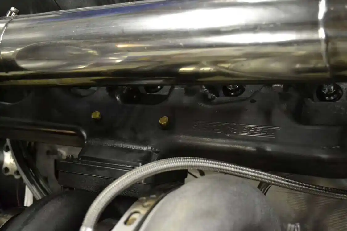 <a href="https://steedspeed.com/">Steed Speed</a> makes the extremely durable stainless steel exhaust manifold that provides the mounting for the large-frame turbo system. A T6 flange exit (T3 is stock) directs exhaust gases into the smaller of the two enormous turbos.