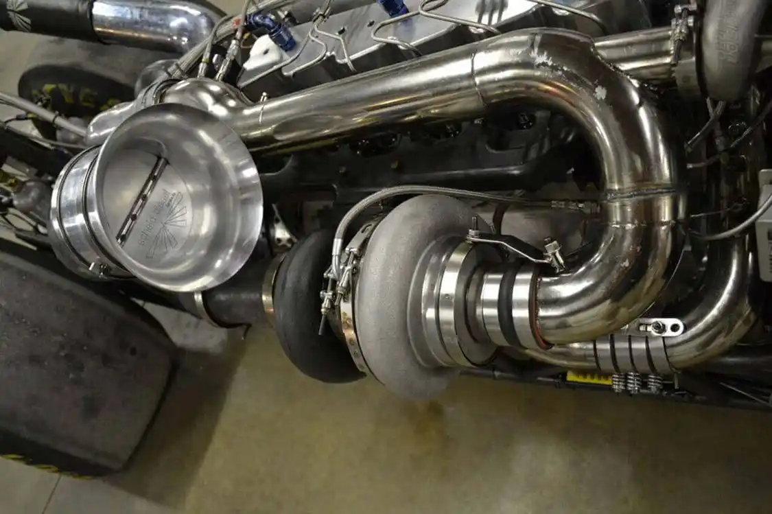 Monster power takes monster airflow and, in this case, the Scheid dragster definitely doesn't disappoint. The high-pressure (manifold) turbocharger is an 88mm Precision unit, while the larger charger is a <a href="https://www.myholsetturbo.com/index.html">Holset</a> HX82 that houses a 114mm billet wheel from <a href="https://www.precisionturbo.net/">Precision Turbo</a>. The two chargers combine to produce a whopping 140psi--kept in check by a 66mm Precision Turbo wastegate--all the way up to the engine's 6,000rpm redline.