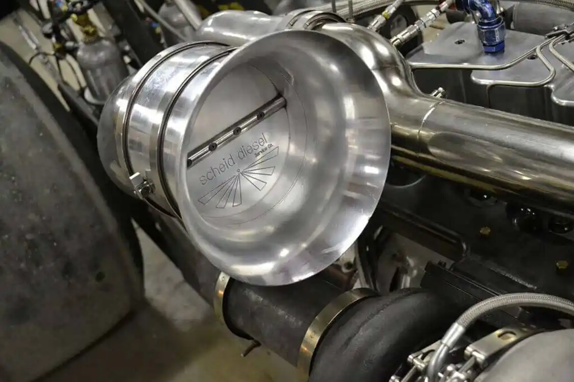 Since Scheid Diesel specializes in extreme diesel performance for sled pulling and drag racing, many of the parts on the Scheid dragster come from Scheid's own catalog, like this positive air shutoff, which will shut down the engine in case of a stuck throttle or other nasty situations.
