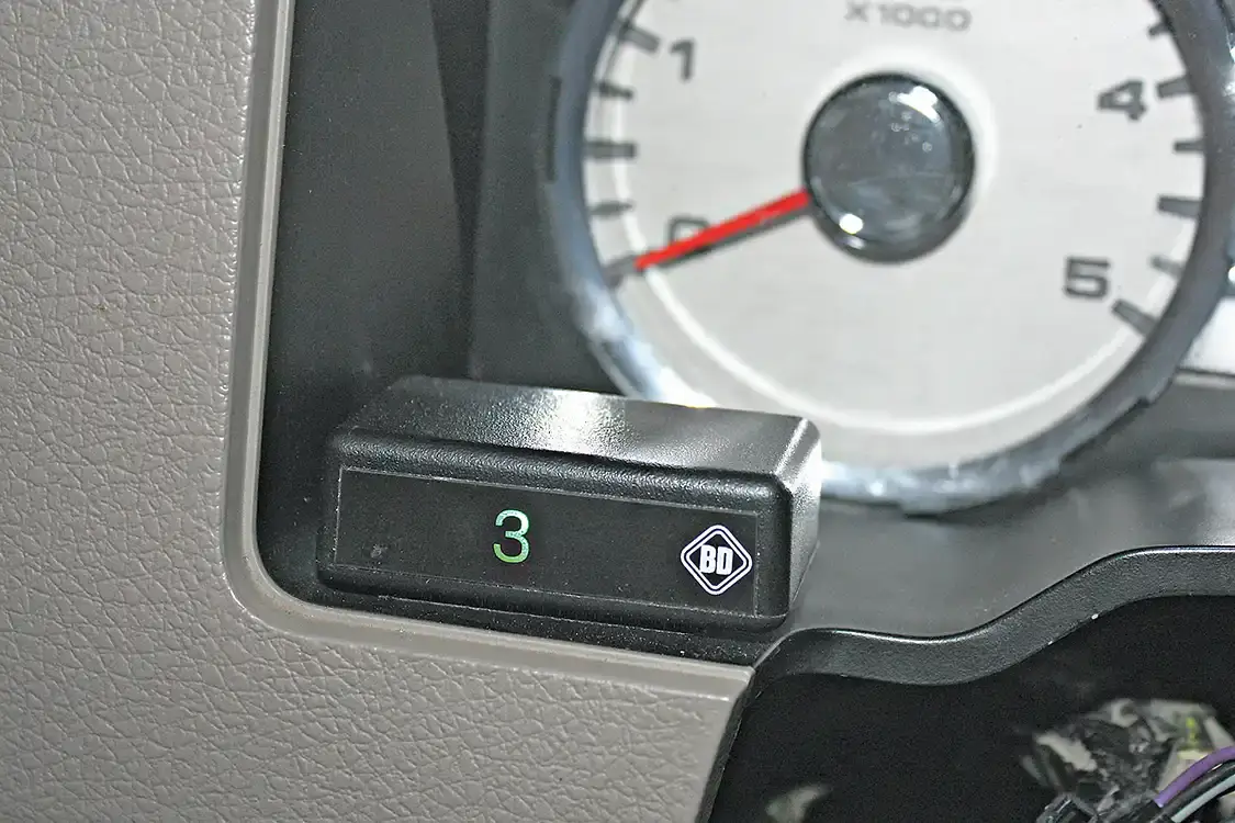 9. The Tap Shifter kit includes this handy little display to show drivers which gear has been selected while in the manual shift mode. The module will display gears 1-5 as selected by the button on the shift lever. It can be placed within easy viewing right on the dash panel behind the steering wheel using the included double-sided Velcro tape (no drilling required).