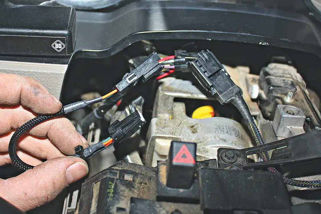 12. As mentioned before, when running the BD VVT Exhaust Brake module in conjunction with the Tapshifter module, their wiring harnesses will be plugged into each other and then piggybacked into the factory wiring harness. While it seems complicated, it really is quite simply to assemble and will work flawlessly if done correctly.