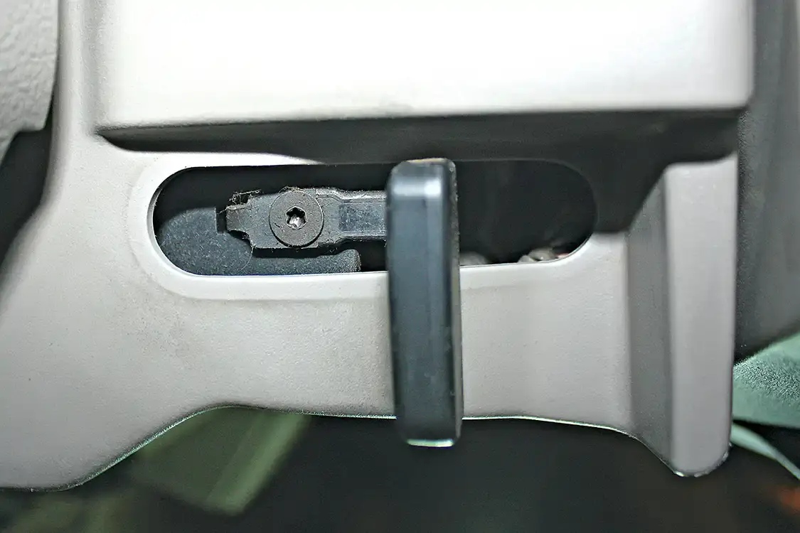 5. The plastic steering column cover needs to be removed to gain access to the factory shift selector so it can be replaced with the newer 2011+ shift lever with built-in Tapshift buttons. There are a few screws on the bottom panel attaching it to the column, but in order to remove the cover all together, the tilt wheel lever has to be removed. You can simply slip the rubber grommet out of place and access the T20 torx screw holding it in place.