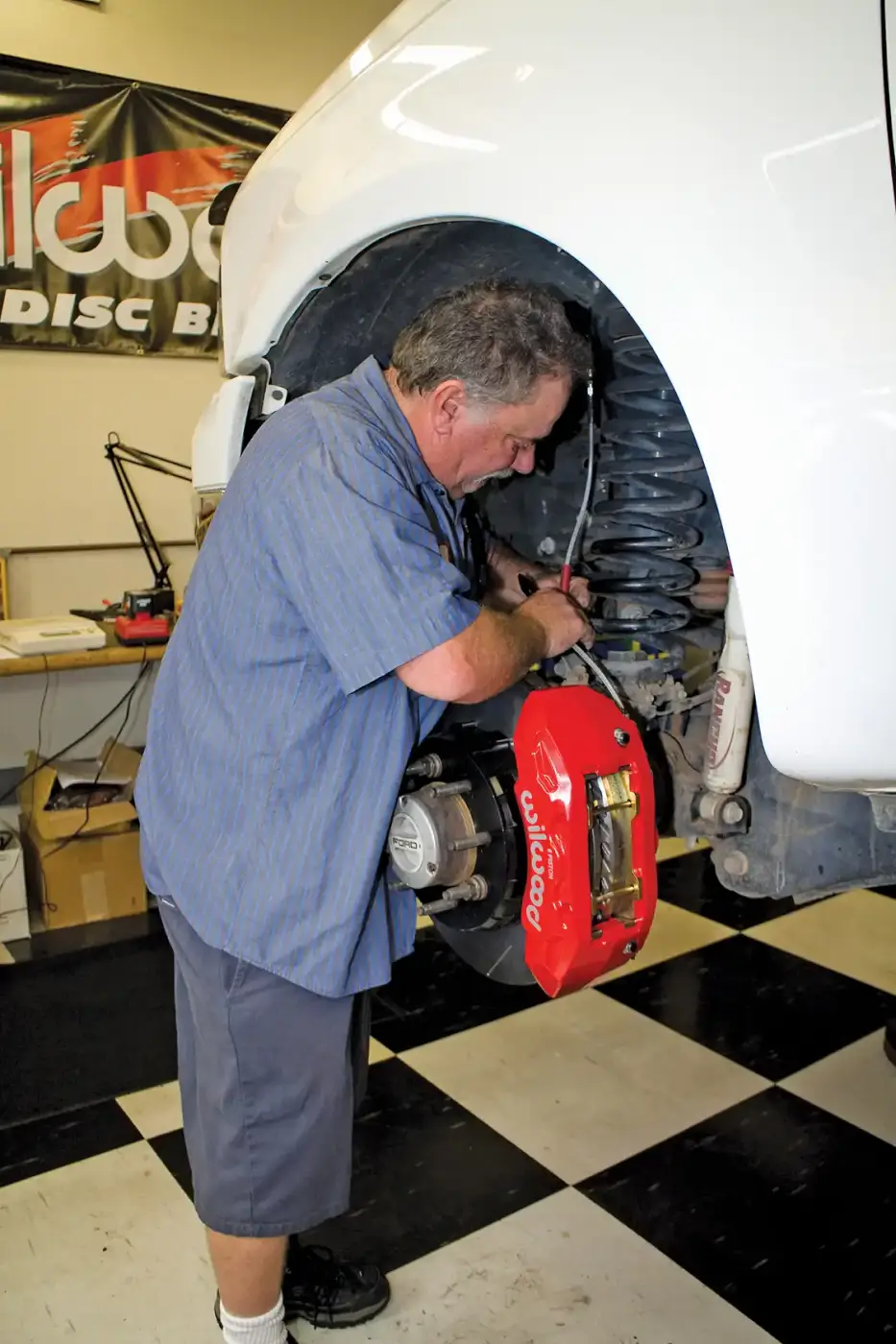10. The new brake calipers are plumbed into the system using new braided stainless steel flex lines. These are longer than stock in order to work with the new calipers, and are less subject to expansion than the OEM lines. This means more pressure goes to the pads rather than to ballooning the brake lines.