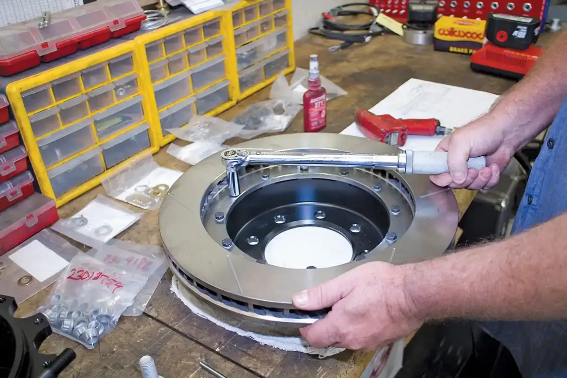 3. The Wilwood brake kit, some with new rotors and hats. On the EOM rotors, the hats are part of the casting. Wilwood provides separate two-piece rotor and cap assemblies. They must be bolted together before installation. Be sure to use red Loctite and torque the bolts to spec.