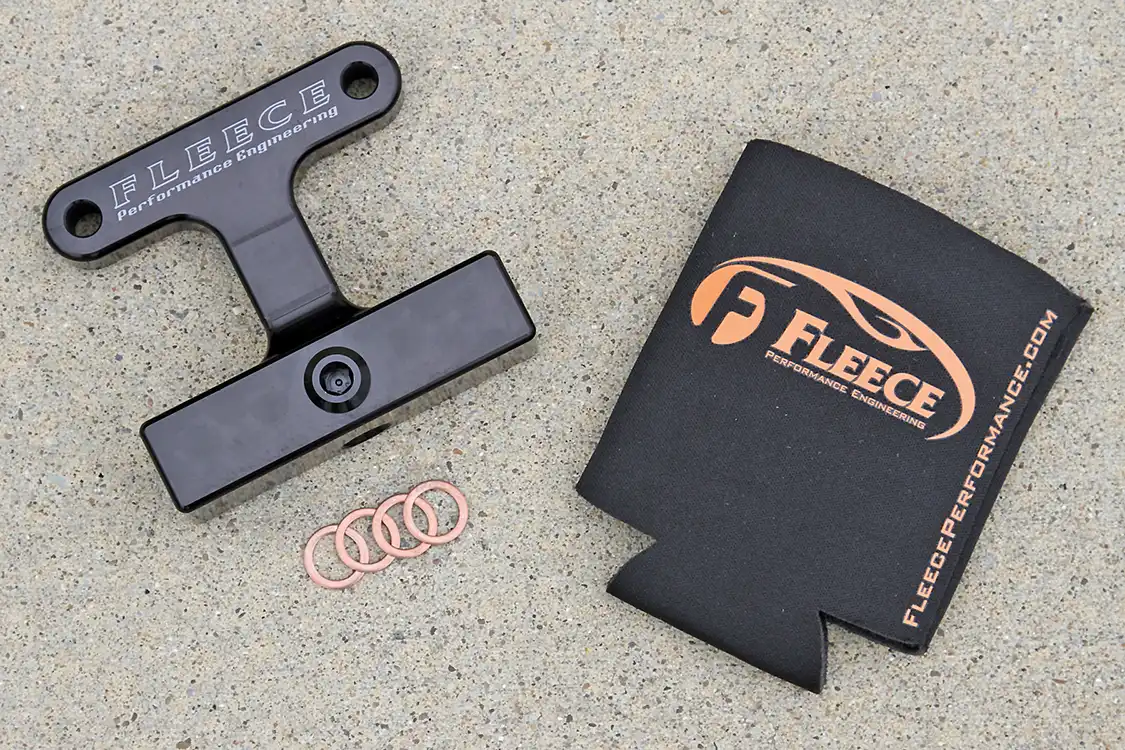 4. Since the AirDog's filter and water separator are easier to get to than the factory fuel filter we chose to install a Fleece filter delete that even comes with a cool Koozie to keep your favorite adult beverage cold until after you finish the installation.