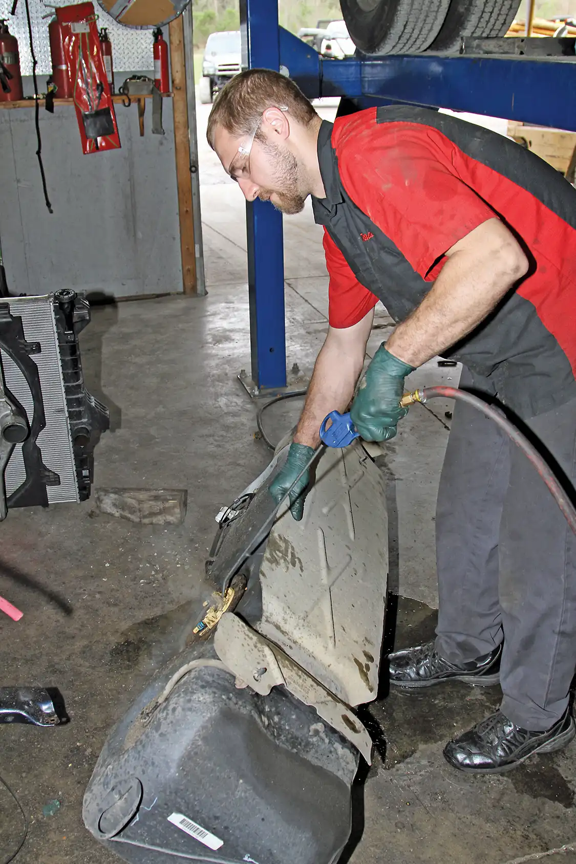 18. After the tank drained, he removed it and cleaned away years of construction site and road debris from the sending unit/pump assembly before removing it from the tank.