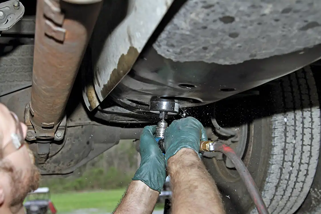 21. To install the BDP fuel sump, Grubb cuts the hole into the bottom of the tank. After cutting the hole, he debured the edges with a sharp blade and wiped away any debris from the cuts.