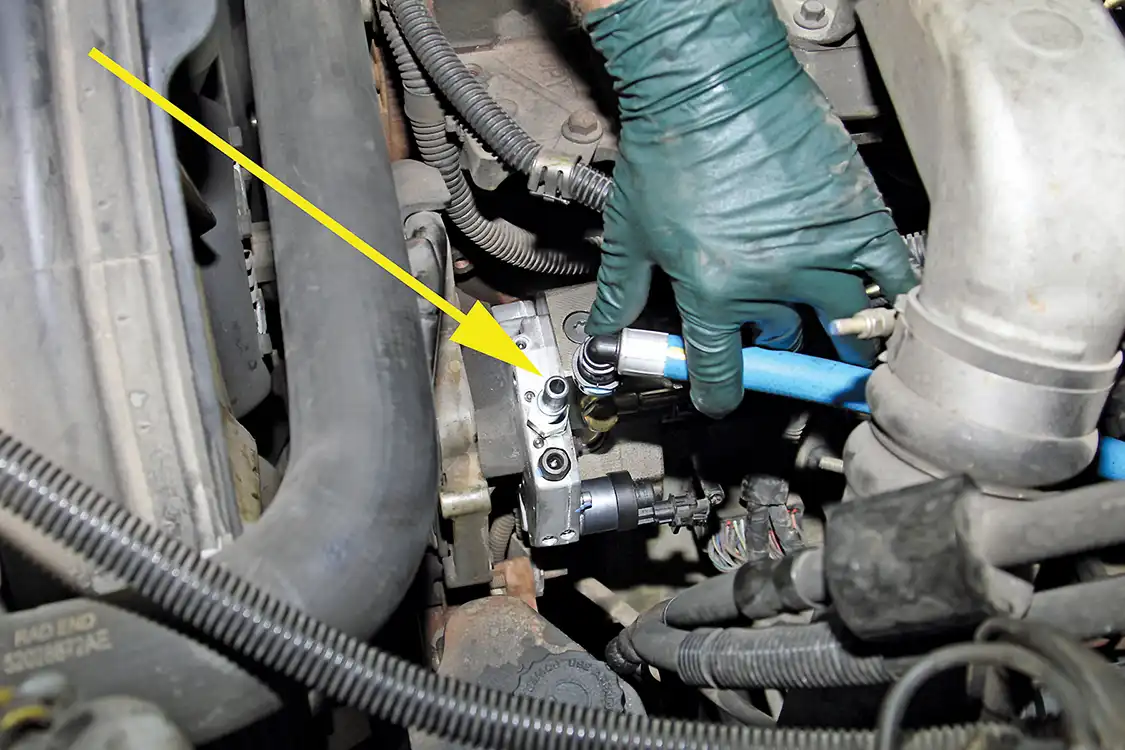 25. After installing the supplied fitting into the Fleece PowerFlo 750 CP3, Grubb connects the fuel hose from the AirDog pump to the CP3.