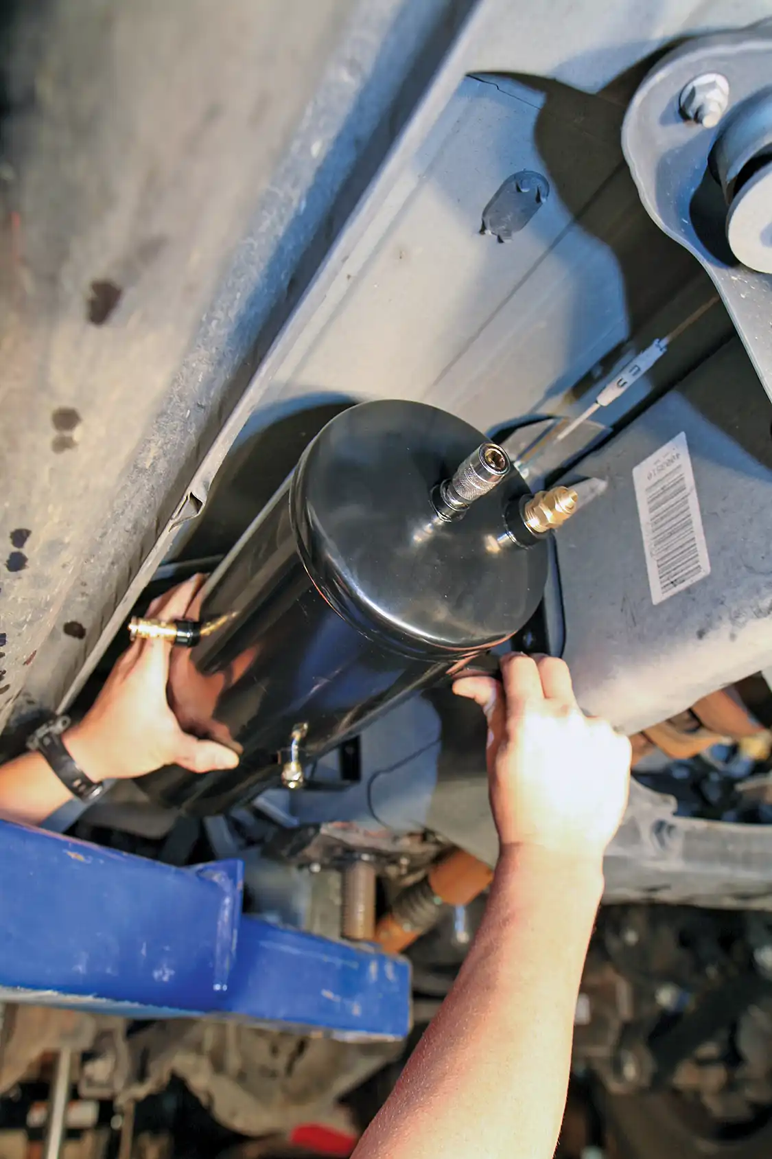 7. After careful consideration, we decided to mount the air tank to the outside of the driver's side frame rail, under the cab, out of harm's way.