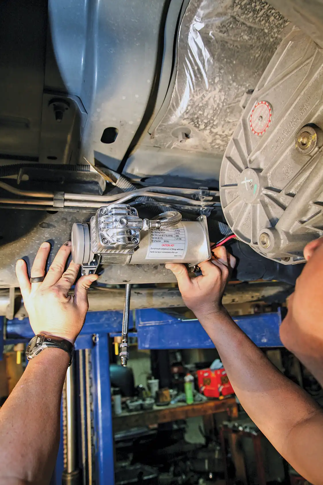 8. We chose to mount the Kleinn air compressor on the inboard side of the passenger's side frame rail, away from the exhaust heat and off-roading impact zones.