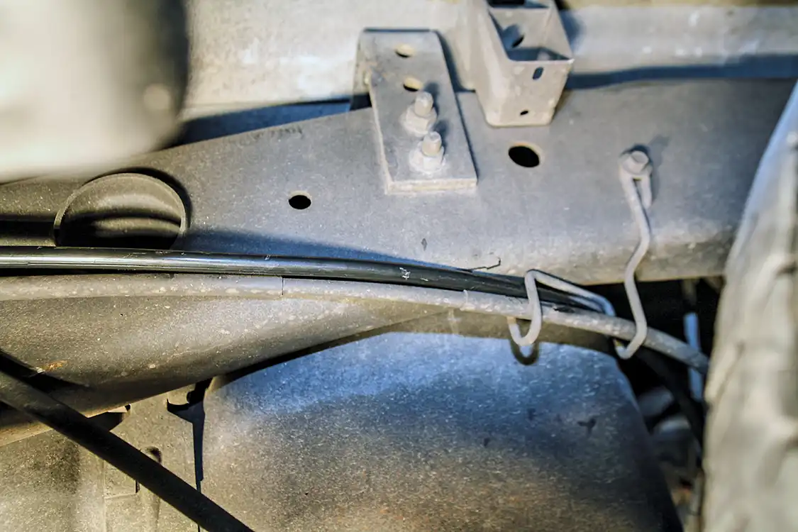 14. We used the factory emergency brake cable hanger and routing locations to plumb the included Kleinn airline from the tank back to the air horns.