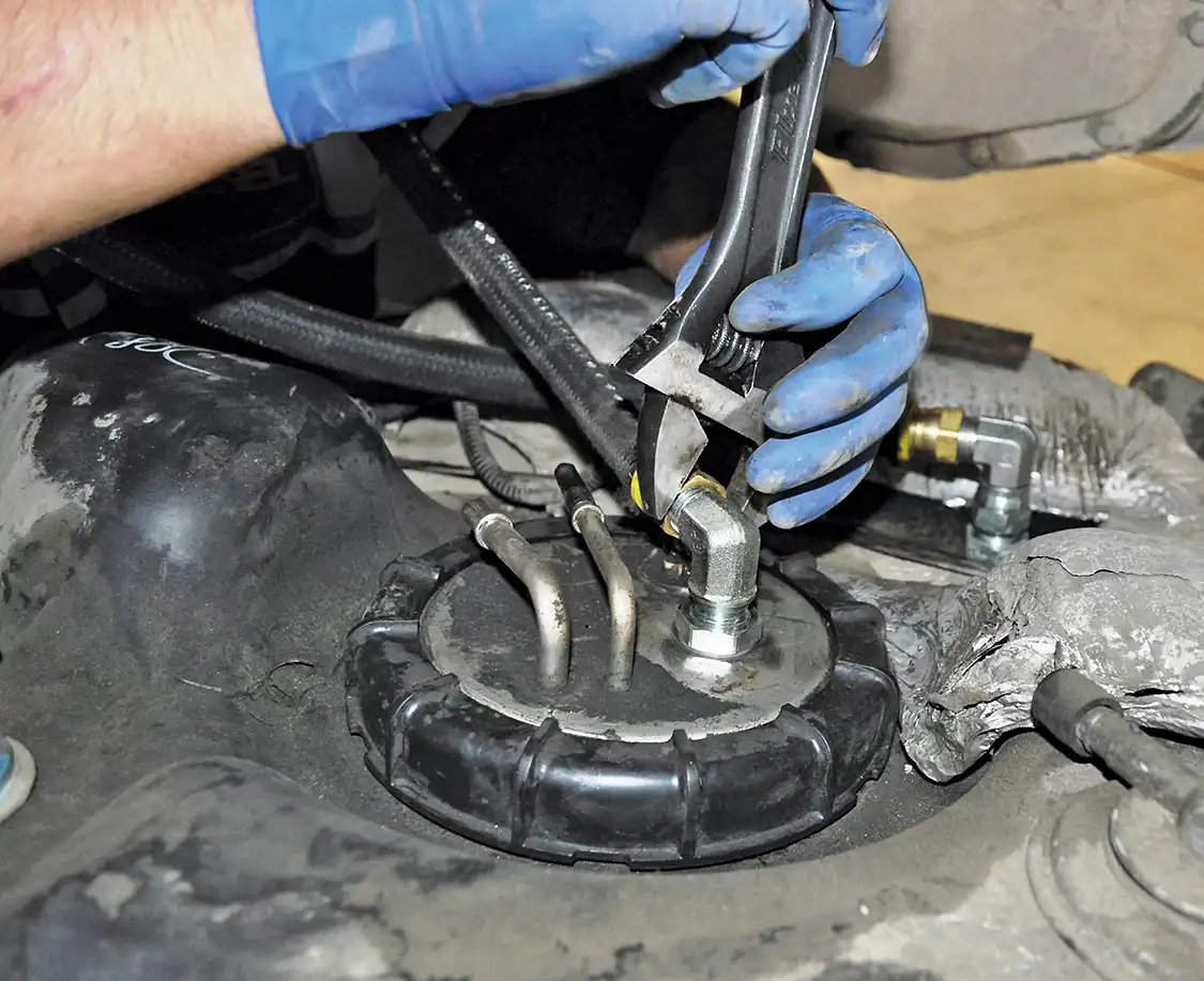 19. The fuel lines then thread on using AN-type fittings. Once tight, the tank could then be reinstalled into the Excursion.