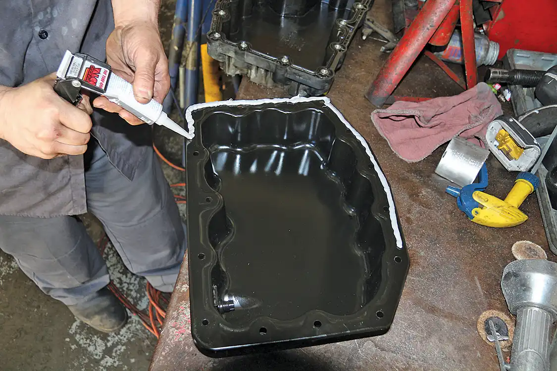 9. Using a silicon sealer rated for engine use, Hermosillo seals the new steel (don’t use your bathtub caulking on this one).