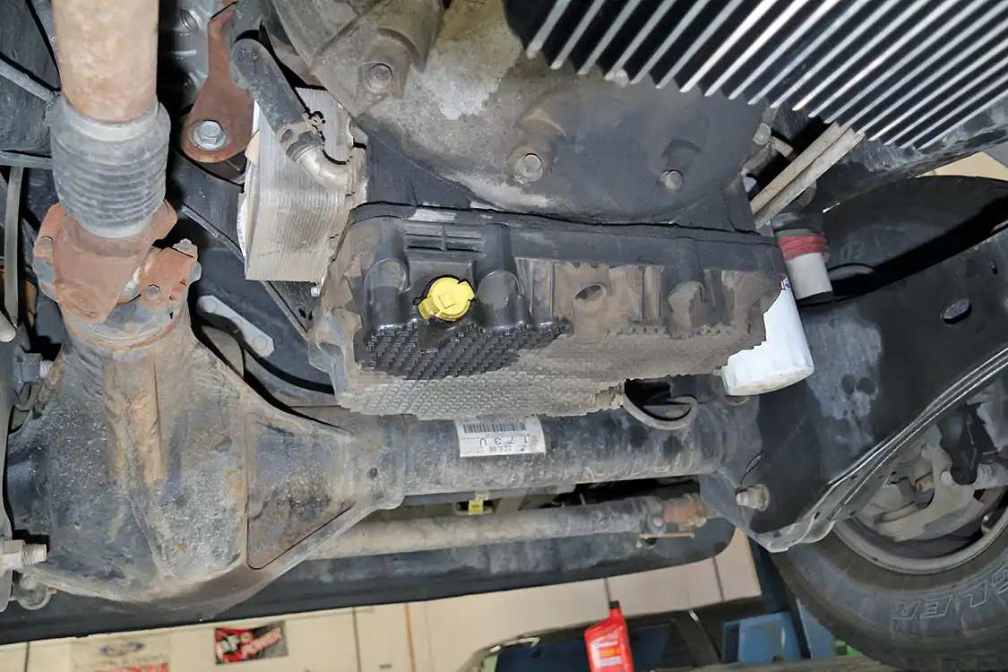 The 6.7L composite pan might be made of Space Age plastics, but it leaks like a Stone Age tar pit. The ¼ turn drain plug just won’t seal, and your truck marks its spot every time you park it. 
