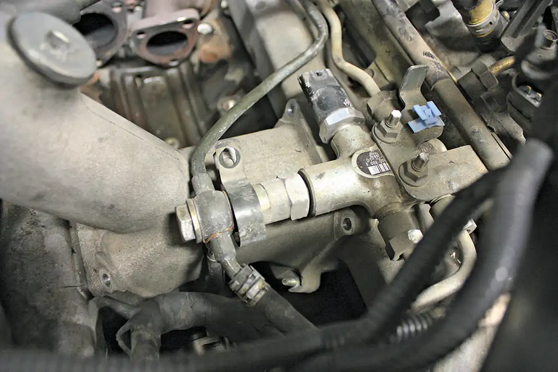 2. On the 2001 to 2004 LB7, the factory fuel return lines will need to be modified to allow enough room for the new HSP Diesel high-flow Y-bridge. Most of the metal hard line, along with the large banjo fitting, will be replaced with rubber hose. The fuel pressure relief valve will all be removed and replaced with low-profile plug.