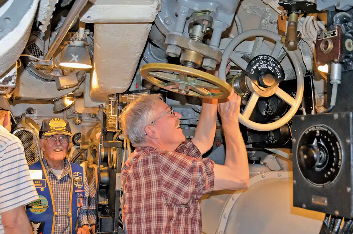  Charles Butcher, Chief of the Boat, opening the exhaust valve prior to starting the motor