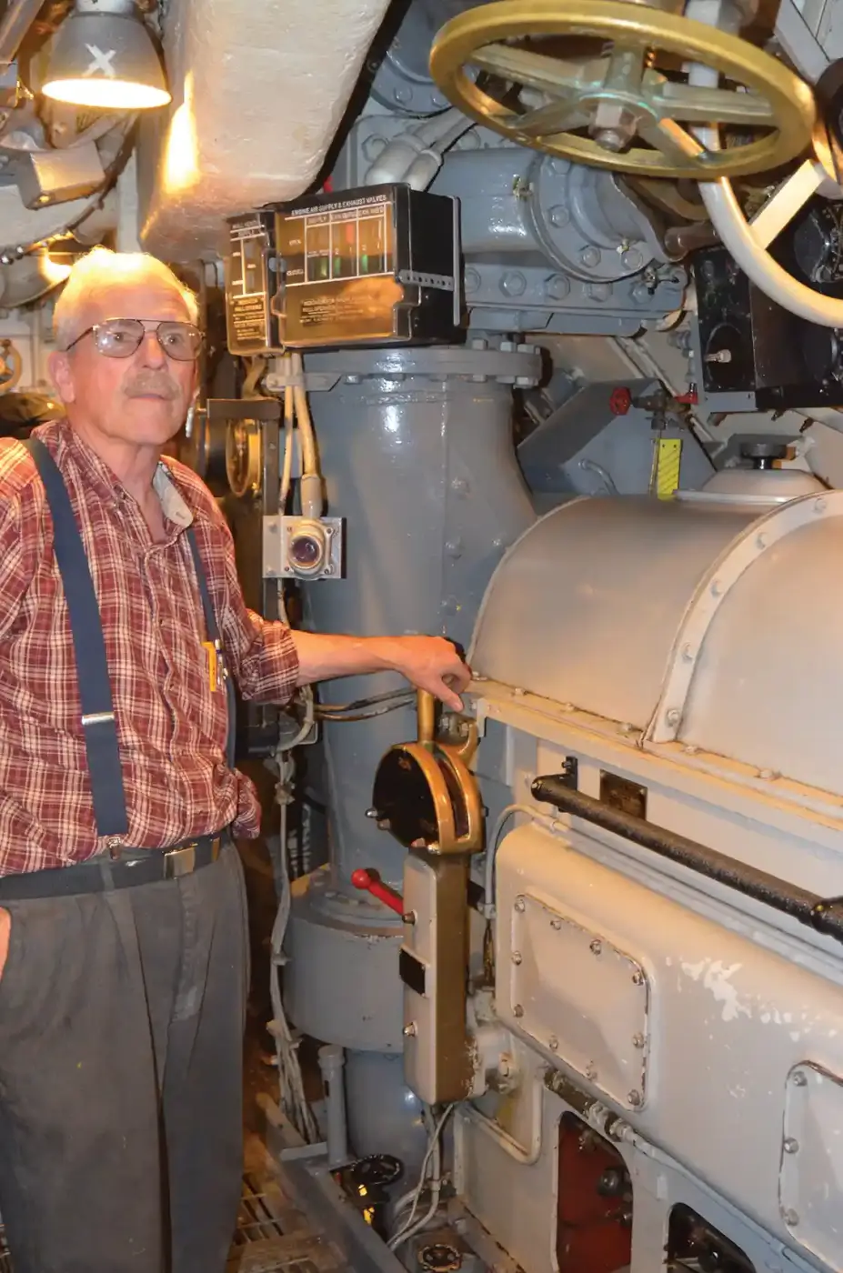 Charles Butcher, Chief of the Boat, starting the motor, rolling it over with high-pressure air.