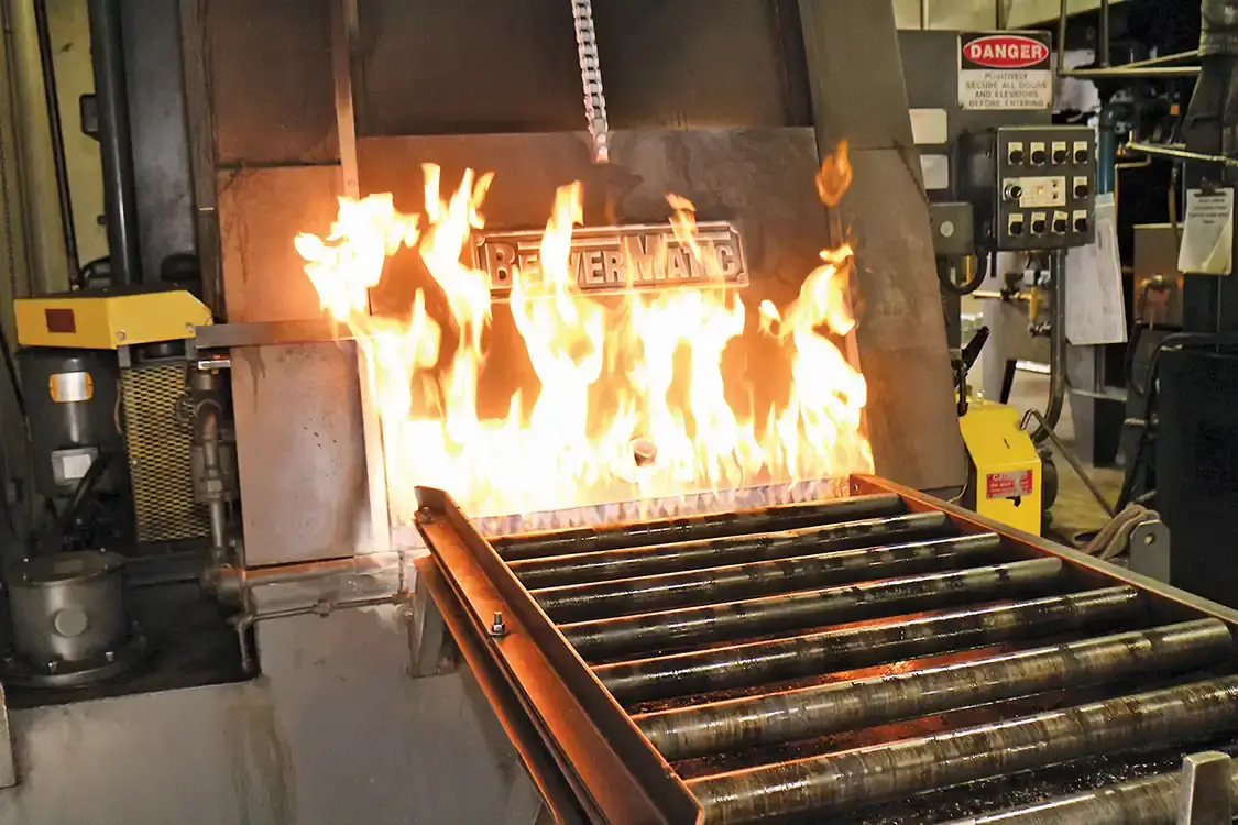Bolts are sent to the heat-treated ovens to get the correct hardness-- not too soft and not too brittle. This BeaverMatic is a hottie and turns soft steel into hard nuts and bolts.