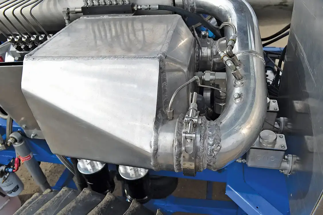 Air-to-Water intercooling has shown to increase reliability and add 100 horsepower or more over water injection alone on top pullers. Rated at 150psi, Jason knows he's pushing the limits on the huge Frozen Boost intercooler, which was the largest unit he could buy.