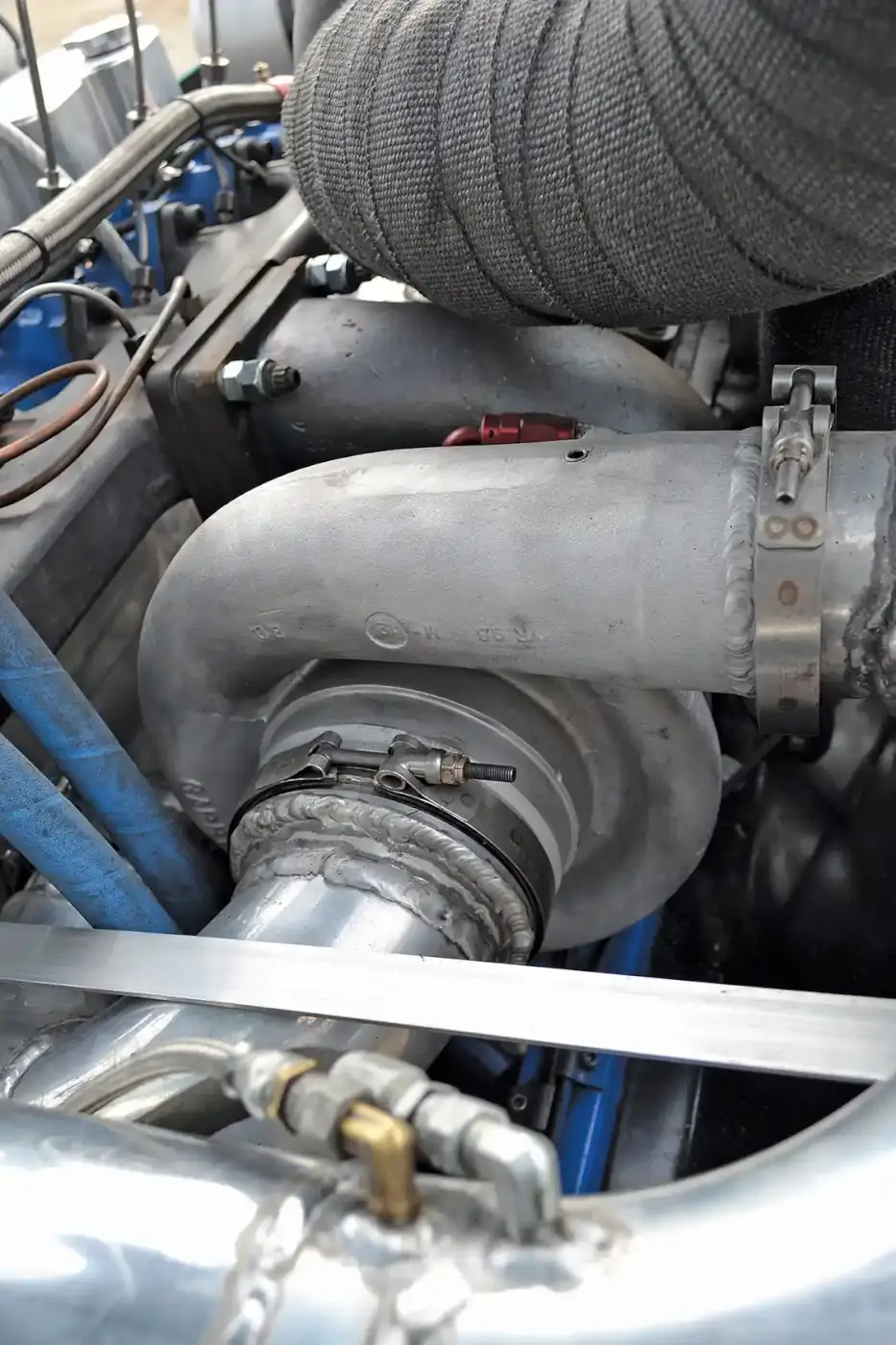 The high-pressure turbo isn't anything you can buy off of a shelf; rather, it's an old experimental Garrett turbo built with a variety of parts that he used to run on the first iteration of his pulling truck. All three turbos combine to produce a while 155 psi of boost when Addicted is pulling.
