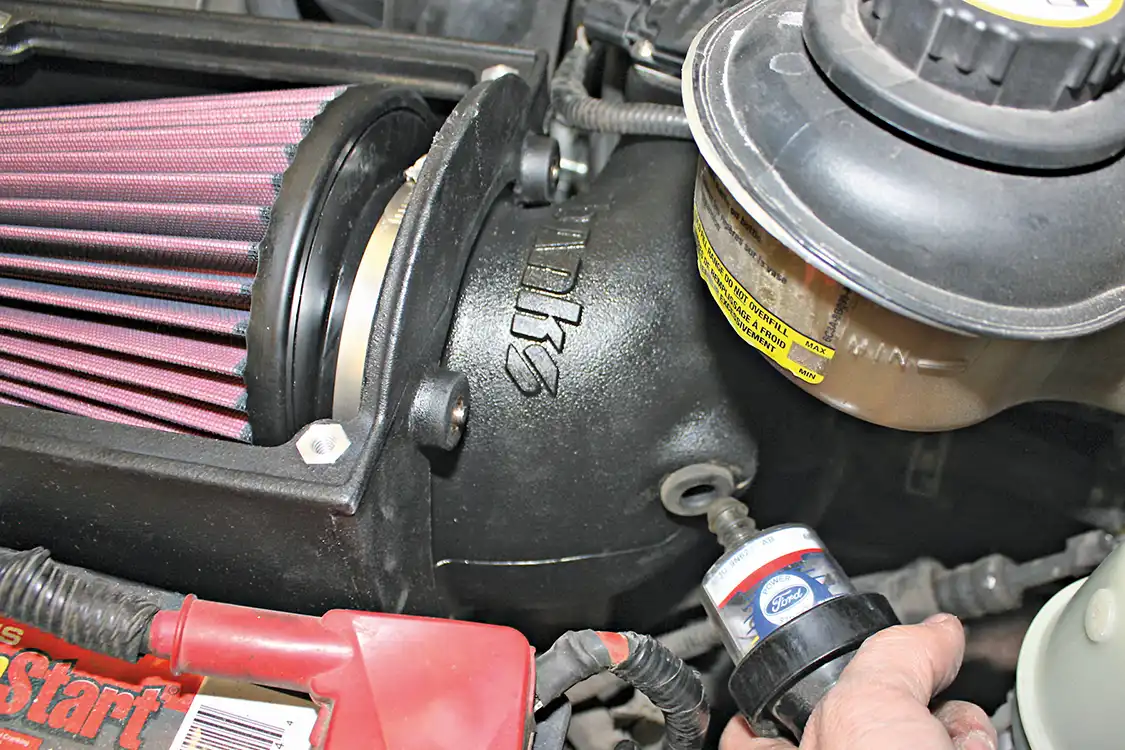 3. The new Banks Ram Air box goes in just as easily as the stock system comes out. You’ll want to first secure the main box to the outlet piece with the supplied bolts before dropping it into the engine bay as an assembled piece. The factory filter minder and mass airflow sensors will be reinstalled into the new Banks intake with supplied grommets and seals.