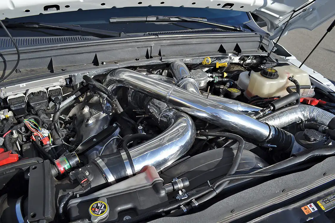 Often factory pieces are incorporated into a turbo system build. Here the stock water-to-air intercooler is being used on a 6.7L Ford with an upgraded turbocharger.