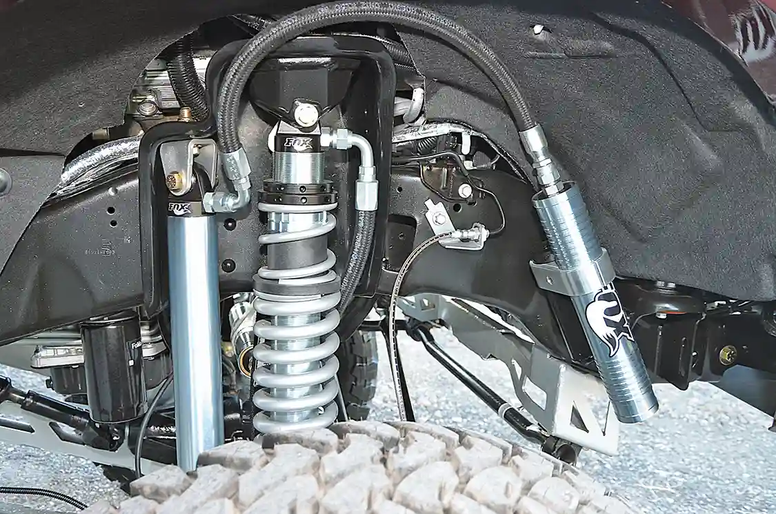 The Fox coil-over shocks, Eibach coils and secondary, remote reservoir Fox shocks stabilize this ride at all speeds.