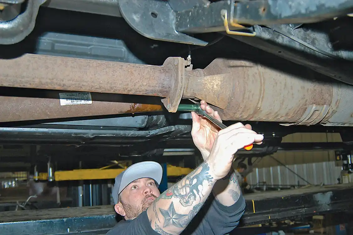 Two bolts at the back of the DPF were removed, the after axle section was unbolted, and then the stock-after-DPF exhaust was removed.
