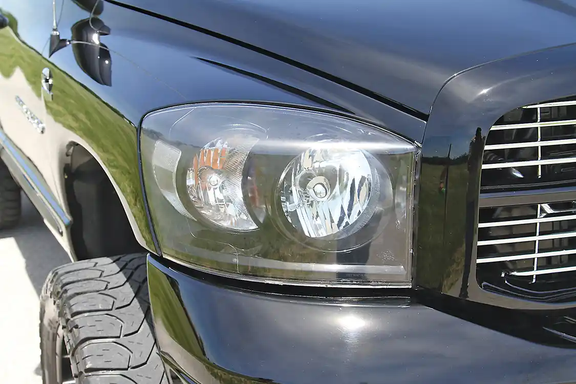 Finke disassembled the headlight housings and color matched the inside, then resealed the housings to give her truck a sinister look. The dark housings use HID bulbs to cut through the darkness. The taillights and cab markers were also blacked out but with tinted units from Recon.