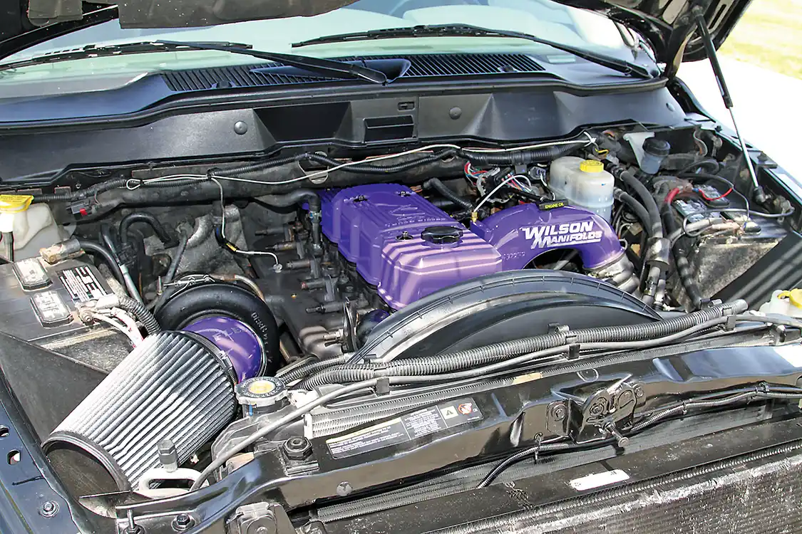 Lifting the hood, you’ll find the bright purple paint highlighting the intake manifold, valve cover and turbo intake.