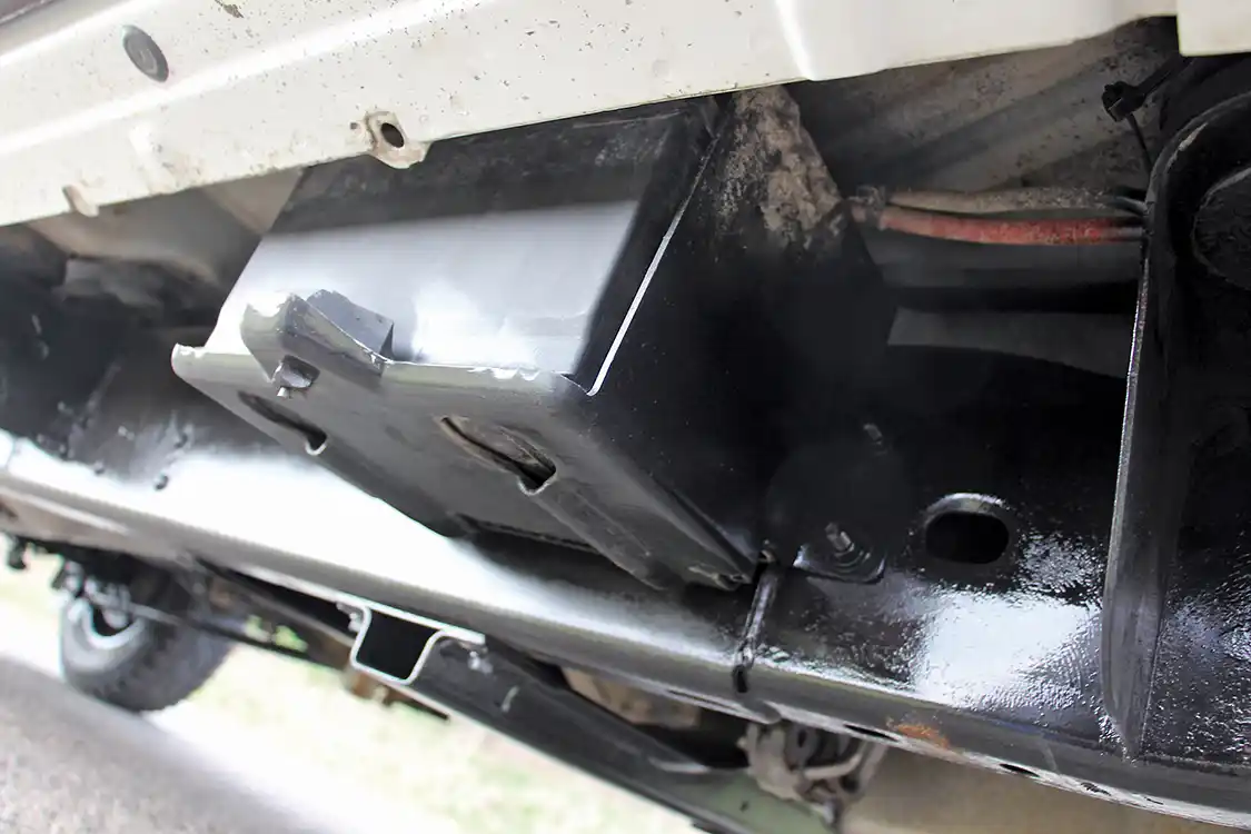 With the billet S475 taking the place of the passenger side battery, it had to be relocated. Conveniently, the Wehrli Custom Fabrication compound turbo kit came with a battery tray that effectively mounted it to the passenger side frame rail.