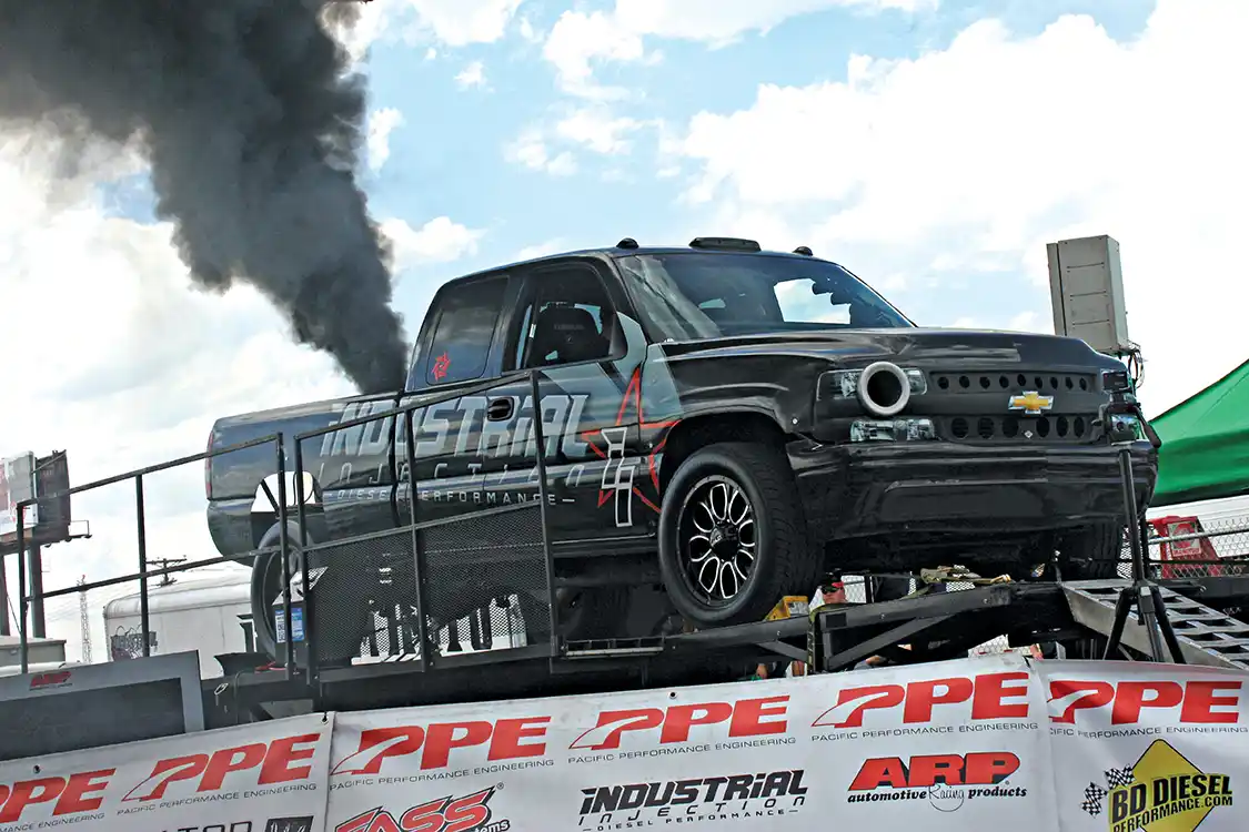 After a catastrophic engine failure just two weeks prior, the Industrial Injection Duramax was back up and running with another full competition motor, ready for the rollers again. On the hunt for that ever so impressive 2000hp, they opted to play it safe on the virgin engine and keep the nitrous jets conservative—if you can consider 1630hp conservative of course—which was still enough to claim highest horsepower on the day.
