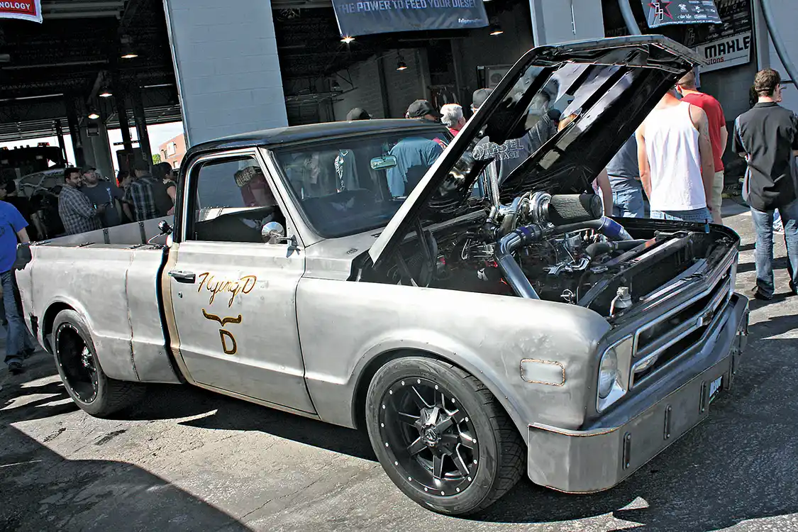 Yet another work of art to come out of the Welder Up Rat Rod shop of Las Vegas, Nevada. This old C10 Chevrolet truck has undergone some pretty extensive metal work, like the custom front bumper and flared bedsides. But more importantly, how could you not love that Cummins engine and custom turbocharger mounted proudly above the hood line.