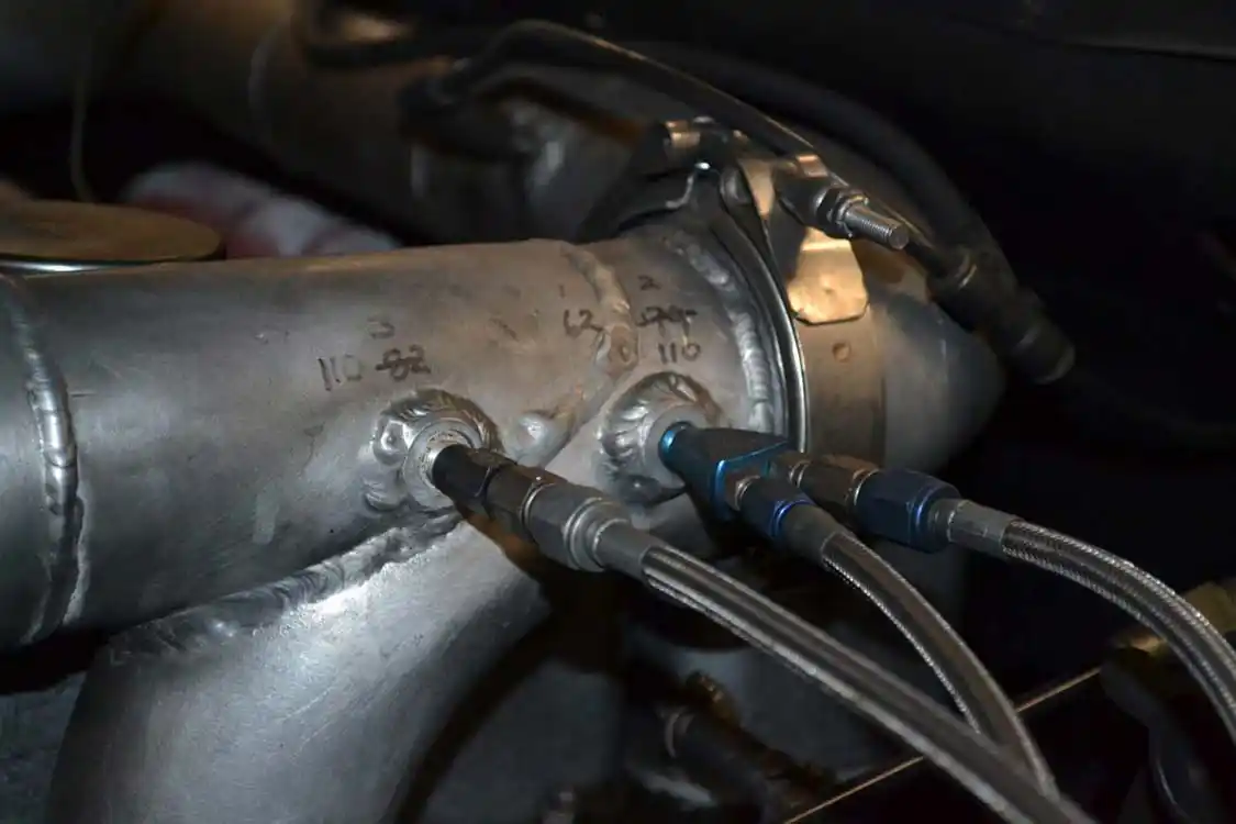 4. Nitrous is most commonly injected after the turbocharger into the intake tract of a diesel. A popular place to install nozzles is right by the intake horn, just before air enters the cylinder head.