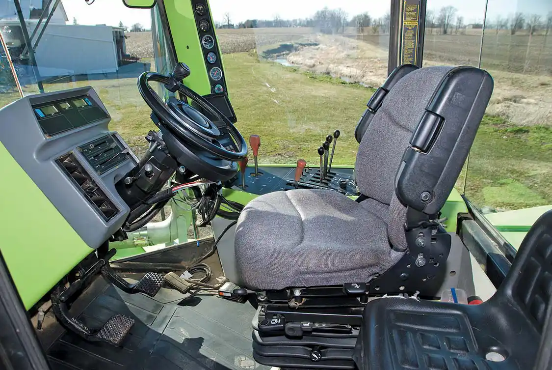 A nice place to work. Plenty of visibility, air conditioning, a suspended seat with armrests, a nice sound system and plenty of controls to keep you occupied. It even has autosteer tied in with a GPS and automation for planter and fertilizer application. The hour meter shows 1380 hours.