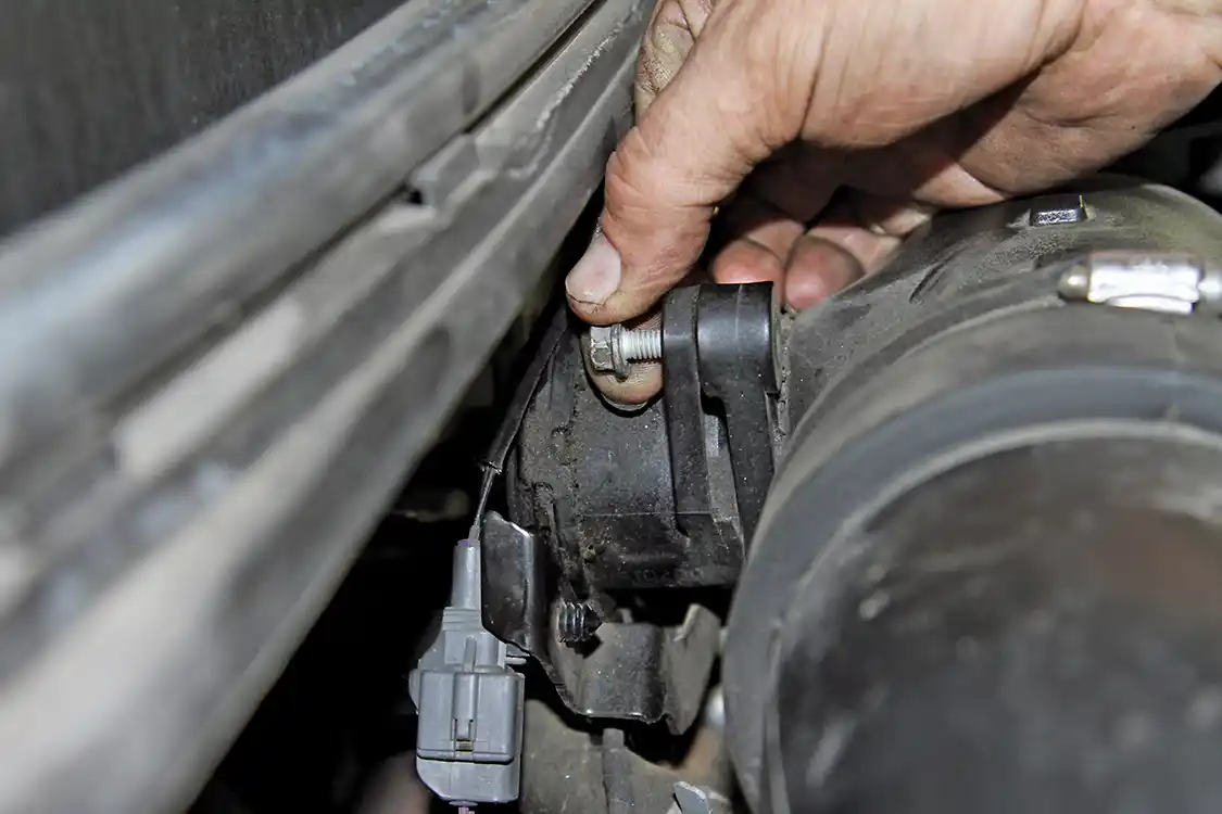 11. After loosening the top bolt, it can be threaded out by hand.