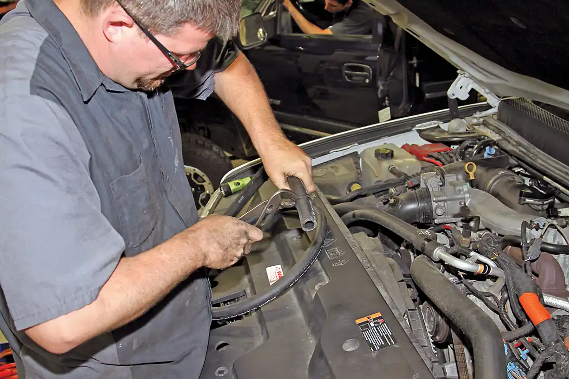 15. Before installing the new hose on the valve cover PCV fitting, be sure to slide the spring clamp onto the hose and a few inches back from the end so that you can slip the hose onto the barbed fitting.