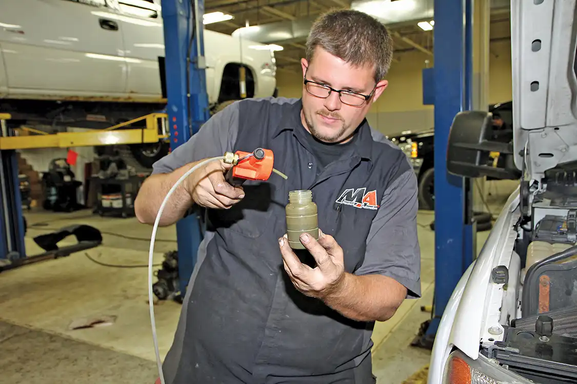 5. After the milky oil filled half the sample container, Phaff removed it from the vacuum pump and sealed the bottle.