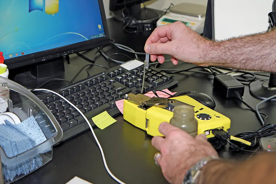 9. A small drop of the sample oil is placed on the scanner to do a fluid scan using the IR Spectroscopy test: It measures TAN, TBM, water PPM, oxidation, nitration, sulfation, glycol percent, and soot to show how much contamination is present and how much usable life the oil still has.